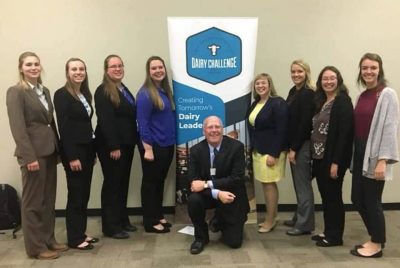 The Dairy Challenge Team (on left side- L-R) Kate Ciaston, Katelyn Allen, Sandra Krone, Sarah Baynard; middle - Coach Dr. Alex White; Dairy Challenge Academy students (on right side L-R) Sarah Thomas, Kennedy Crothers, Becky Wilkins, Ellie Grossnickle